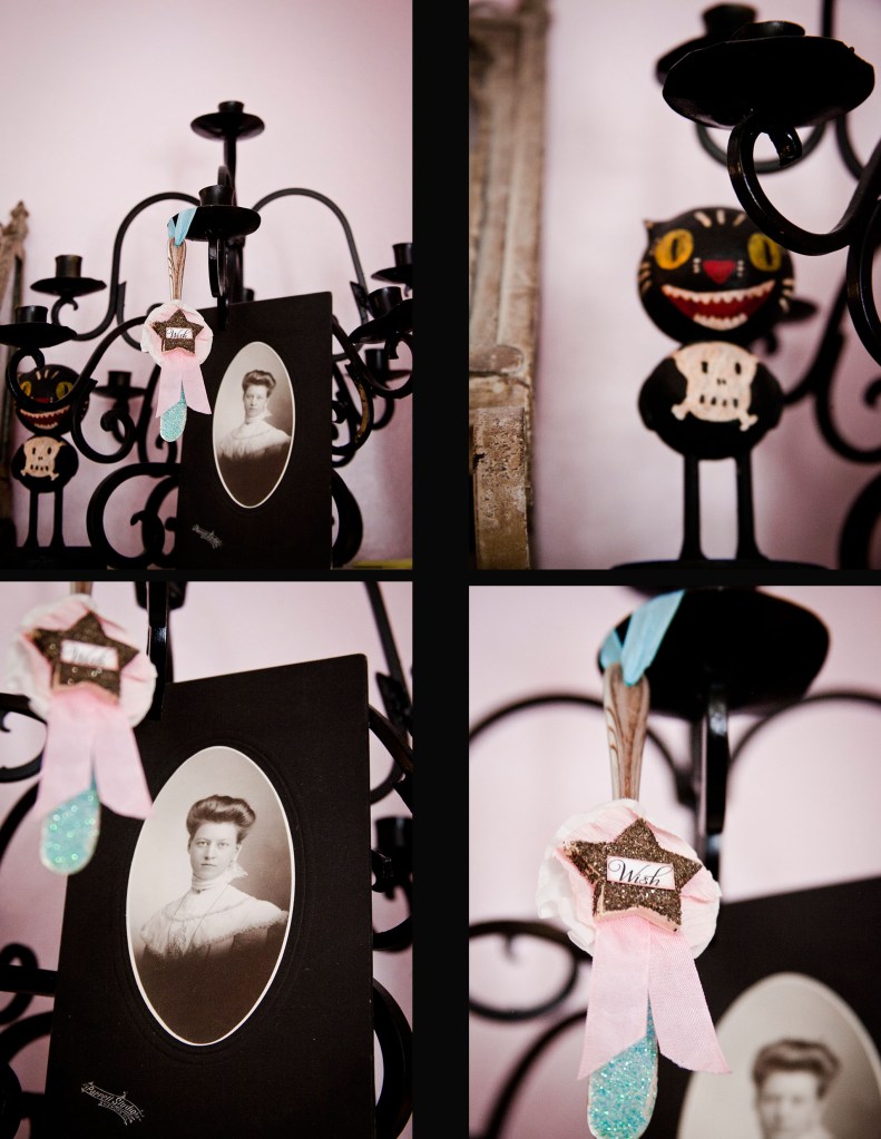 Looking into the shelves, You'll start seeing Mallory's paper creations and old time photographs. I guess you can say it reminds me of Steampunk meets Nightmare Before Christmas with a hint of Hello Kitty! I love it.