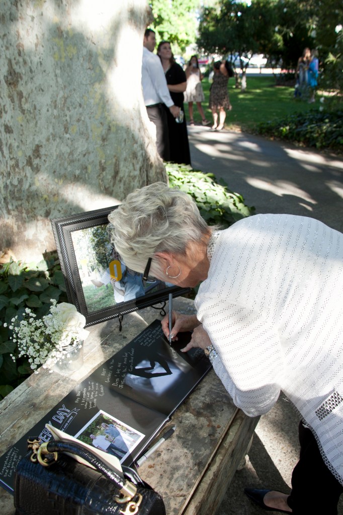 One of my personal favorites. They used the engagement photos I took of them and made a guest book out of them and people signed it using metallic pens. I'm always so so happy when people use their photos. They used their photos throughout the entire reception set-up. Another perfect reason for an engagement shoot.