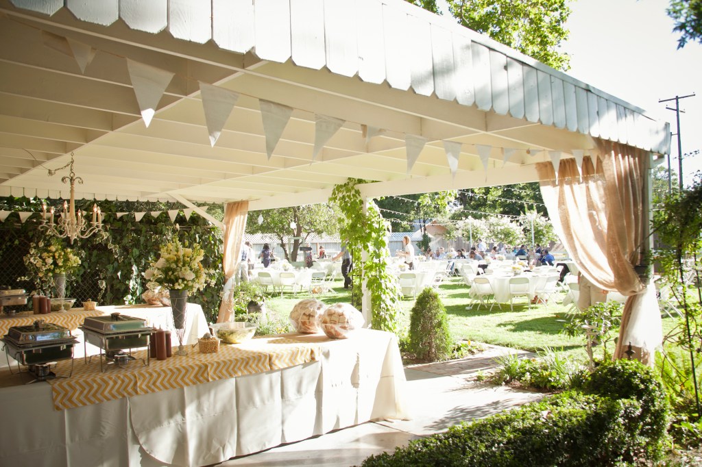 The food was set up under and canopy of tule and burlap. I LOVE the combo and everything blew so sleepily in the breeze. perfect.