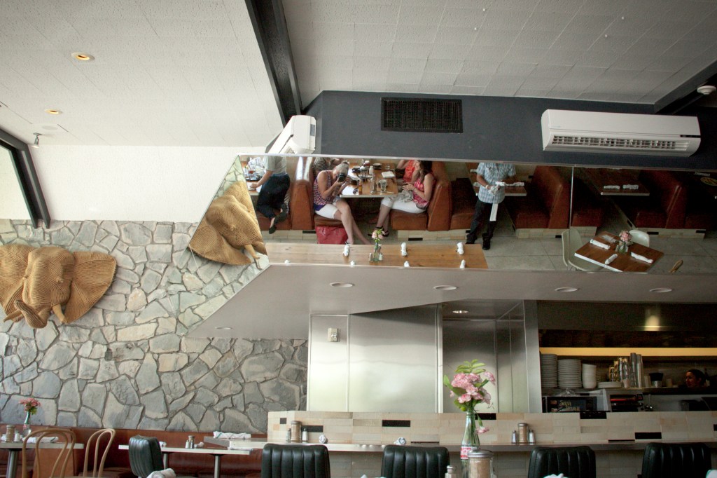 The area over the kitchen and breakfast bar is mirrored. way cool