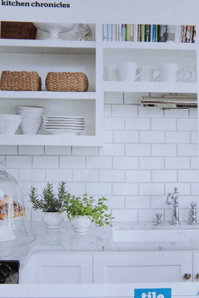 I've been wanting to tile a back splash in our kitchen and I think I'm going to use a white subway tile to do it with! I saw this in a fabulous bakery in Salt Lake City this summer and I'm sold! It looked great and was met with white washed paneling. Look at the next picture.