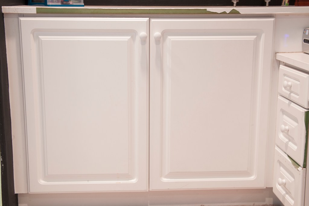 We plan of replacing the counter top and the drawers but in the mean time I've gotten some white duct tape and it actually really helps the appearance.