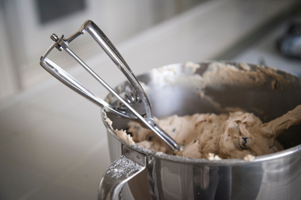 I scoop cookies with a small Ice cream-type scooper. I can't live without it. 