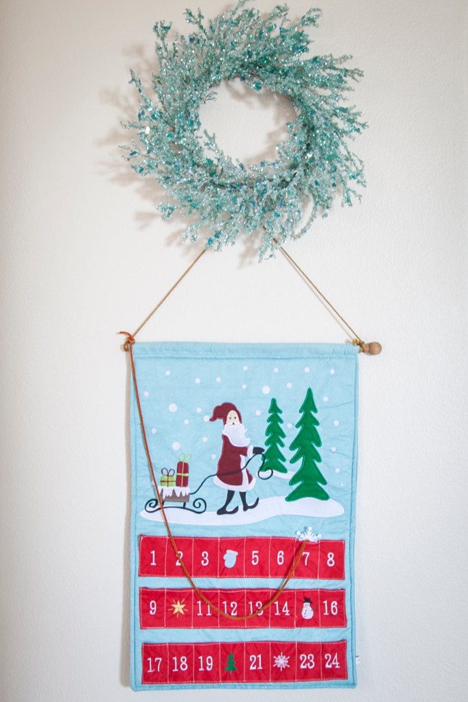 I love this wreath, and this advent calendar is darling. Emma's the biggest date changer.