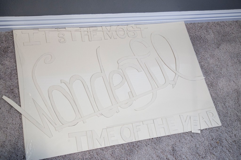 All the lettering cut out. I cut three long pieces of board to attach the lettering to. 