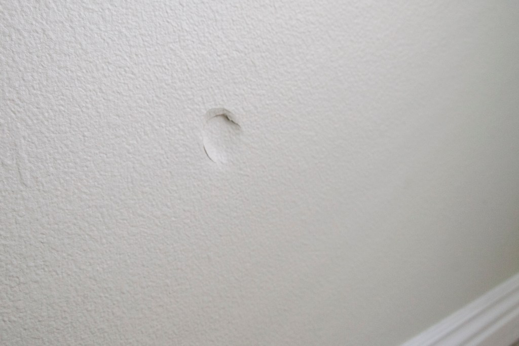 Here is the dent my knee put in the wall...