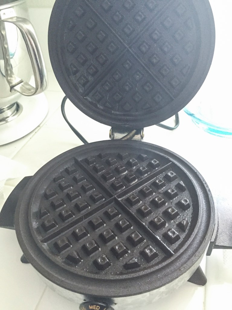 My 25 year old waffle iron, hot and sprayed with coconut oil cooking spray. I really like the coconut oil spray for baking, it's light and slightly sweet.
