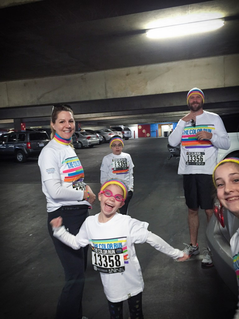 In the parking garage getting ready and pinning on our numbers.