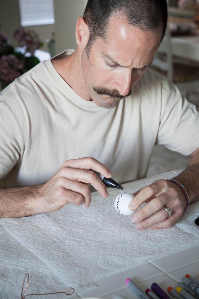 Here's Steve working on his second egg, a Charlie Brown look alike.