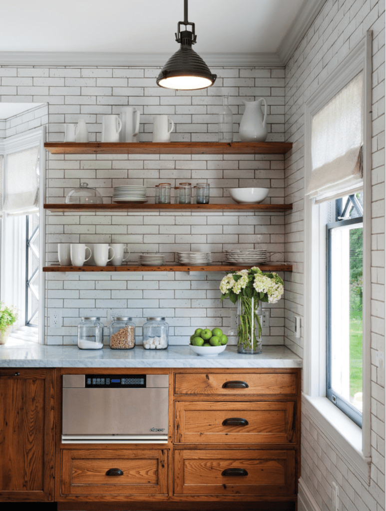 This picture gave me the idea of taking a block of cabinets out and going with open shelving. I'm planning on a subway tile so this seemed cute to me.