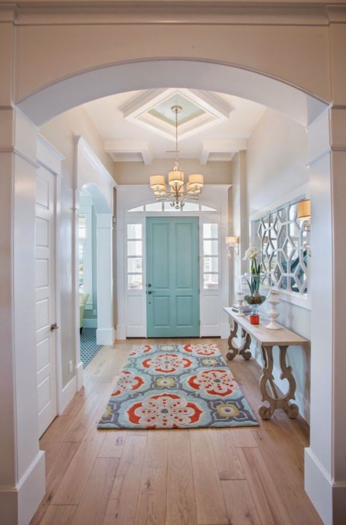 I really love the wood trim here and the column. the light fixture is great and I also like the idea of the runner along with the table. All great ideas that help me visualize the end product of our entry. http://www.houseofturquoise.com/2014/11/highland-custom-homes.html
