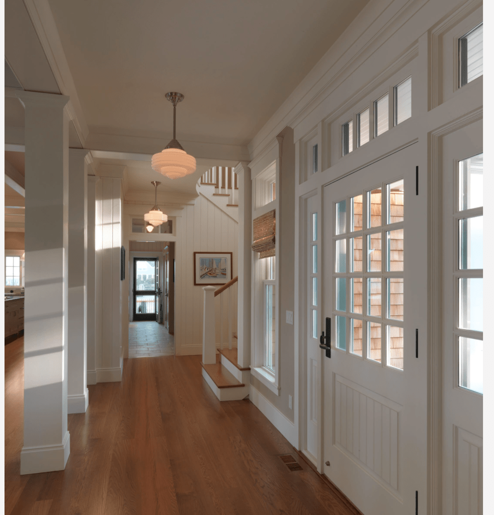 I told you we'd be seeing this picture a lot. Notice the posts in the image. I really want to sheetrock in all the dark brown posts in the house. I'd like them to be painted the same color as the walls and have the same moulding. I think it'll really finish off the look and give us a clean and classy style. 