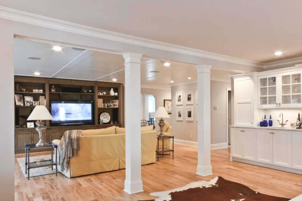 Here is a quick look at a couple of covered posts. I you have to have some posts in the middle of your house, which by the way we do, then this is a pretty nice way to go.  http://www.houzz.com/photos/338280/Classic-Coastal-Colonial-Renovation-Great-Room-traditional-family-room-newark
