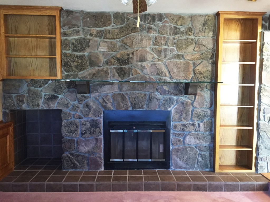 Here is another view of the fireplace in the room. Notice the glass mantle. What? Glass and dark chunky rocks, my favorite! Notice the sarcasm.