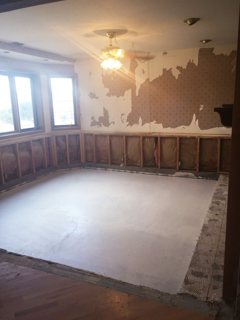 Primer on the floors. I'm lucky to have a brother who is a contractor, and he tells me things to do along the way that just make things a little nicer. This was a big dog pee room so now the floors are sealed, never to see, hear, or smell the dog pee again. I used an oil based primer.