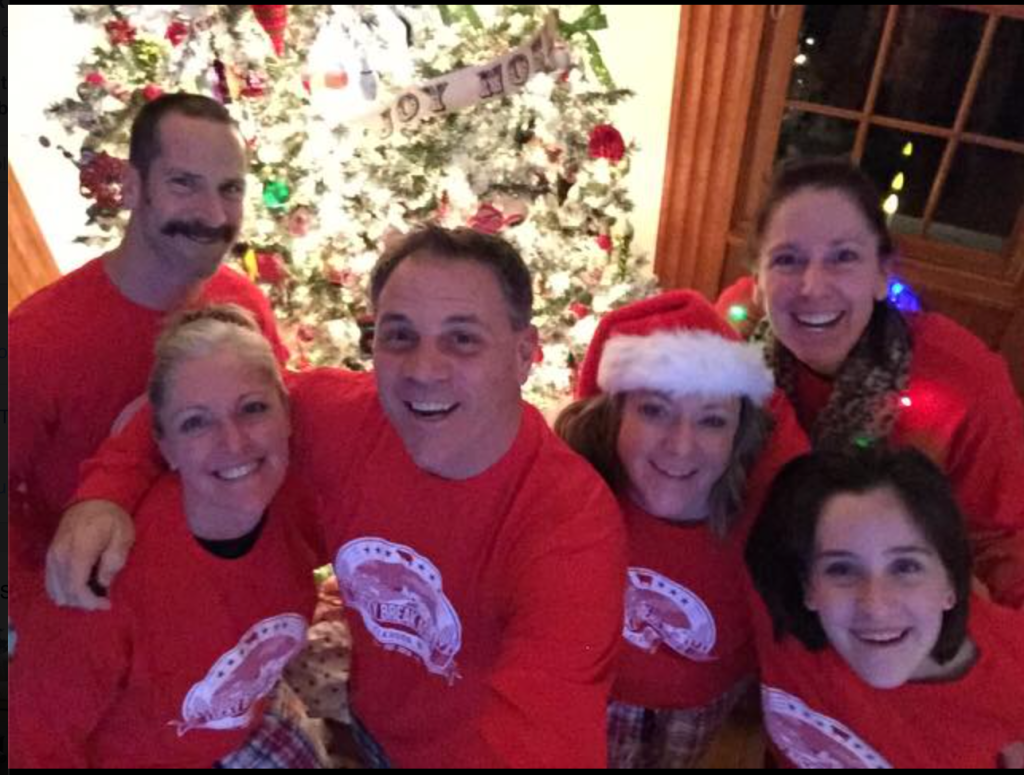 All of us in front of the tree on Christmas Eve!